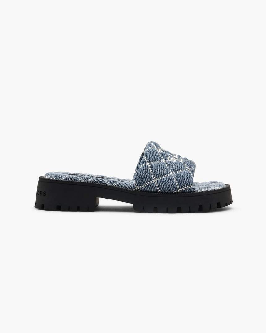 de gewatteerde denim slipper met profielzool