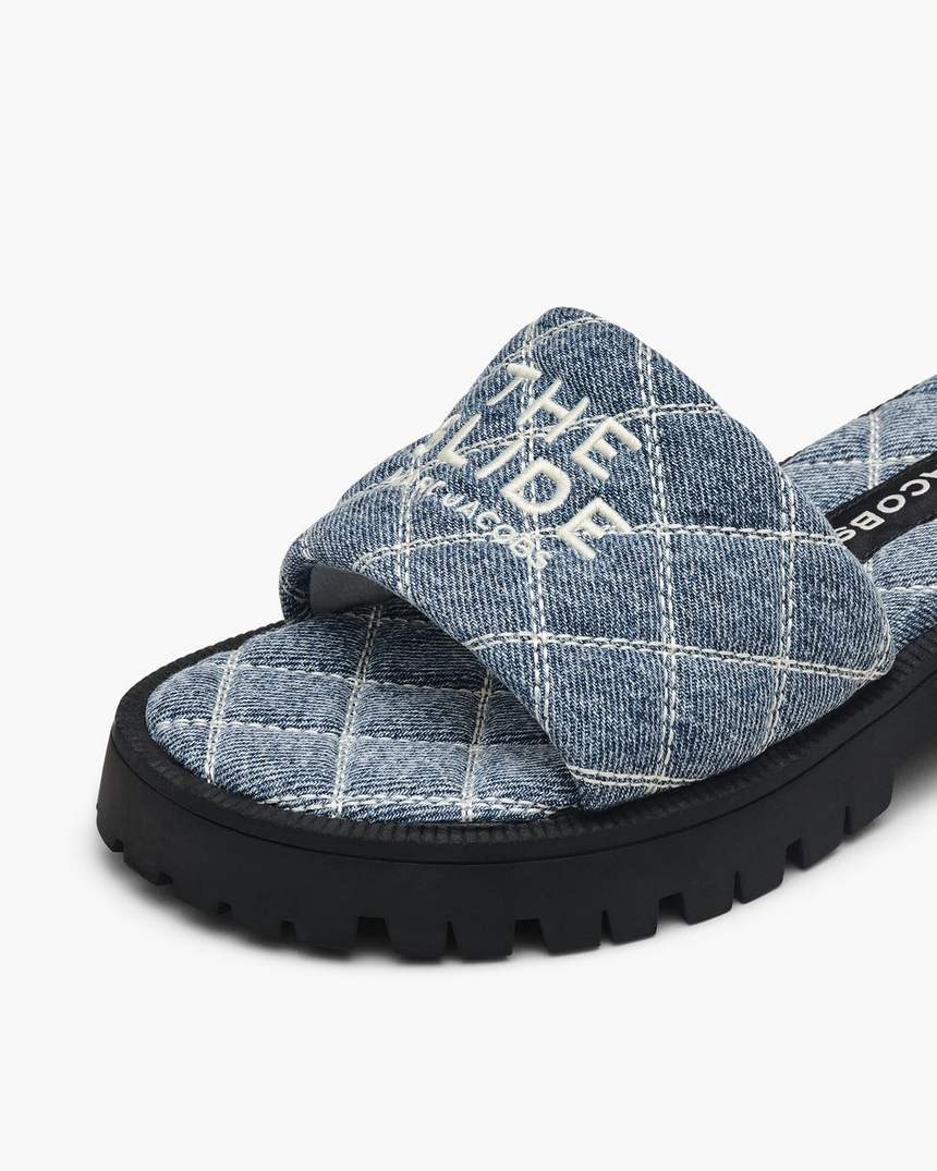 de gewatteerde denim slipper met profielzool