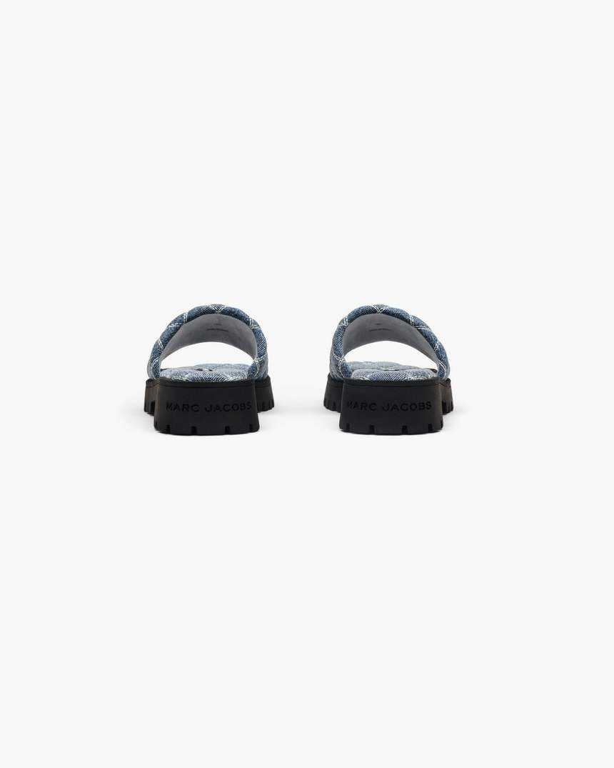 de gewatteerde denim slipper met profielzool