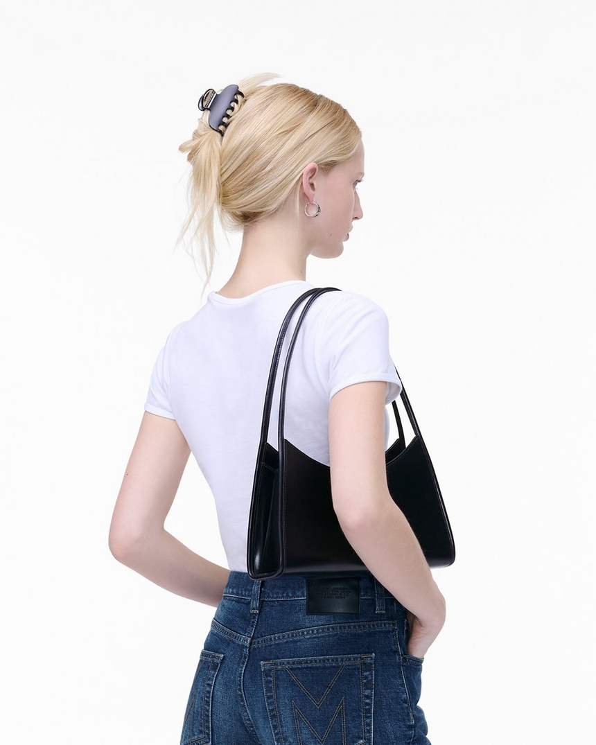 de schoudertas met klauwclip